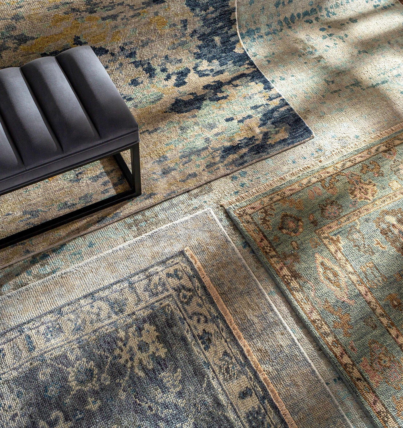 Close-up of hand-knotted Pias Area Rug - Clearance in beige, blue, and gray with a contemporary design and textured wool. Styleshot