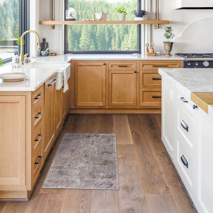 Dusty sage and navy Burstwick Thick Luxe Boutique Rug in a bright, modern kitchen with wood cabinets and white countertops. Roomscene-Rectangle