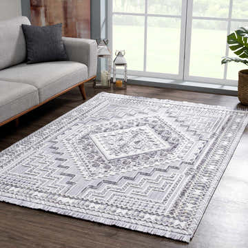 Living room scene with gray sofa and Alya 3D Saxony with Fringes Area Rug in gray, light gray, and white. Roomscene-Rectangle