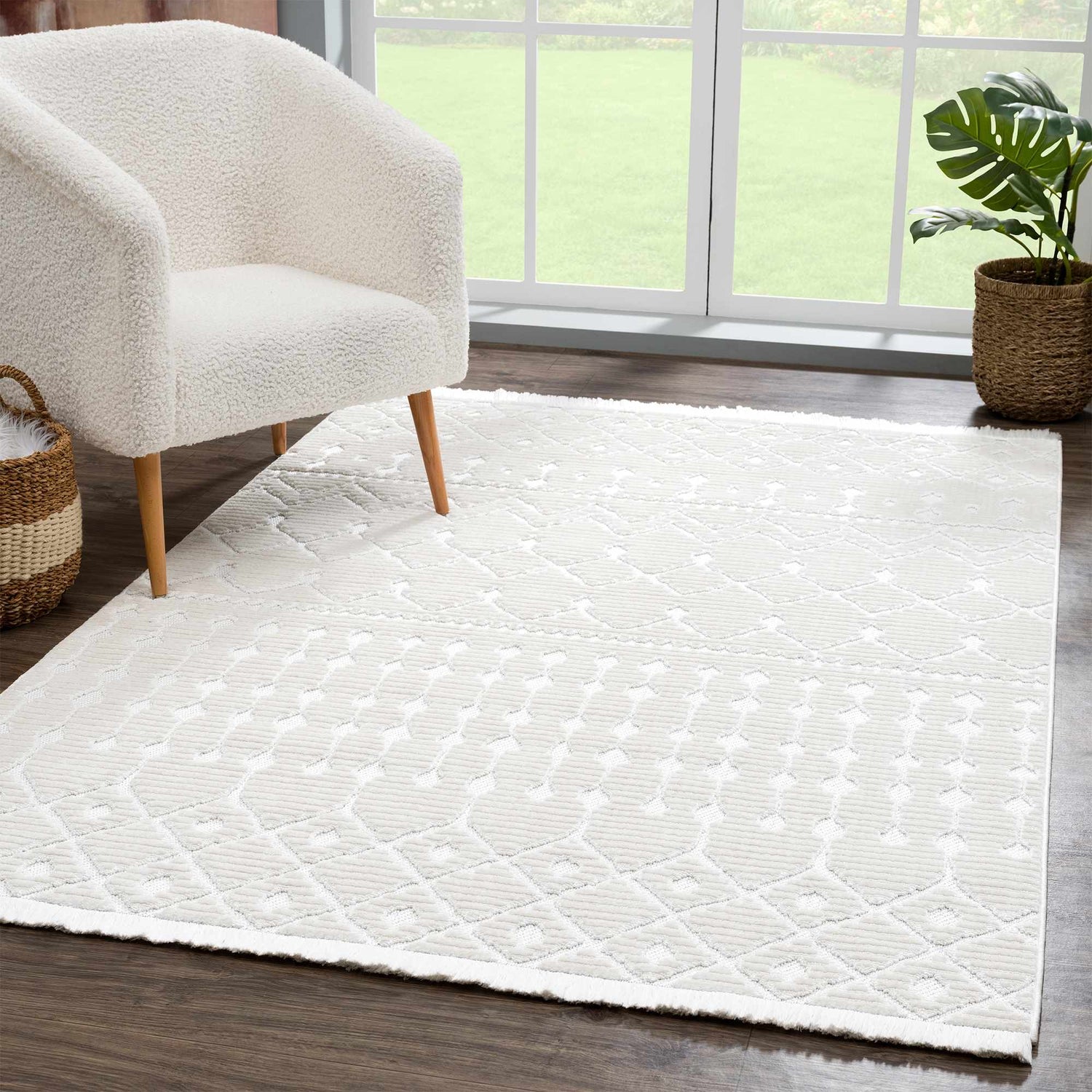 Living room scene with a white sherpa chair on an Ivory Beil 3D Fringe Area Rug. Modern, bright, and inviting. Roomscene-Rectangle