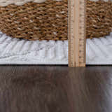 Close-up of the Ivory Beil 3D Fringe Area Rug showing the textured geometric design, fringe, and rug thickness with a ruler. Pile