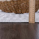 Close-up of the Ivory Alya 3D Medallion Fringe Area Rug showing its texture, pile height, and medallion pattern. Pile