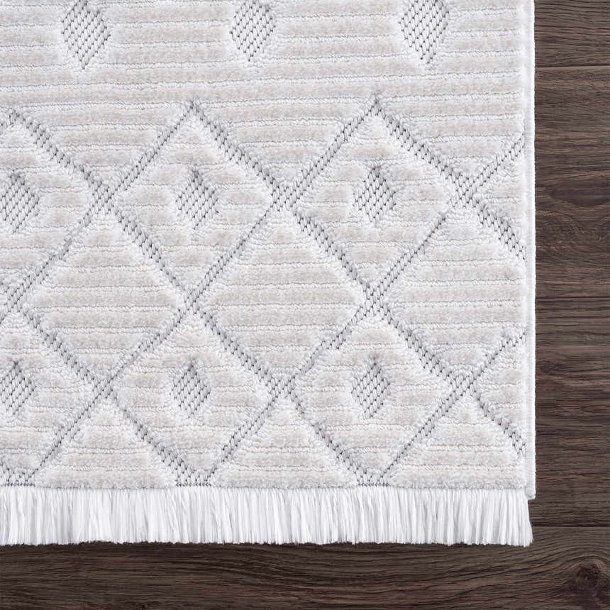 Close-up of the Ivory Beil 3D Fringe Area Rug showing its geometric pattern, fringe detail, and soft, textured ivory pile. Swatch