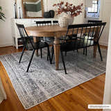 Farmhouse dining room with wood table and Barny Gray Blue Washable Rug on hardwood floors. Roomscene-Rectangle