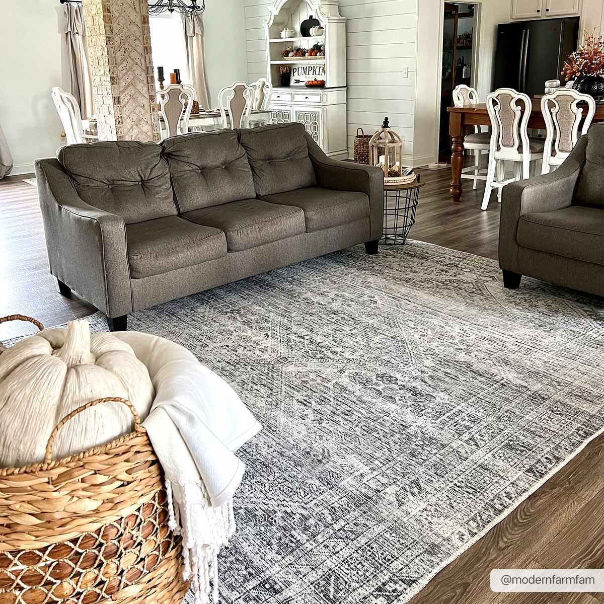 Farmhouse living room with Barny Gray Blue Washable Rug, gray sofa, and rustic decor. Neutral tones create a cozy, inviting space. Roomscene-Rectangle