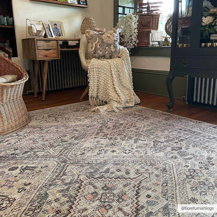 Farmhouse-style room featuring the Barny Tan Washable Area Rug. The rug has a traditional pattern in black, gray, and peach tones. Roomscene-Rectangle