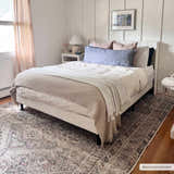 Bedroom scene with a Barny Tan Washable Area Rug under a white bed. The rug has a traditional design and neutral colors. Roomscene-Rectangle