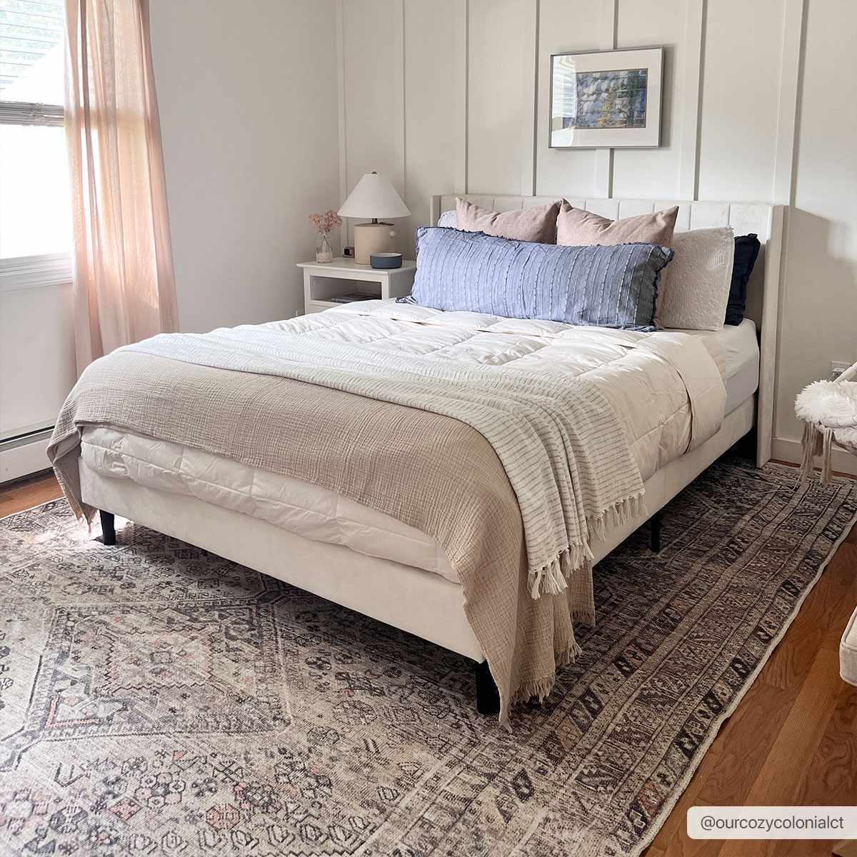 Bedroom scene with a Barny Tan Washable Area Rug under a white bed. The rug has a traditional design and neutral colors. Roomscene-Rectangle