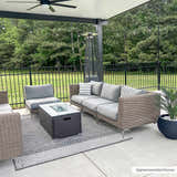 Outdoor patio scene with gray wicker furniture on the Areli Beige / Brown Outdoor Rug. Roomscene-Rectangle