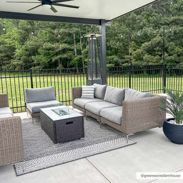Outdoor patio scene with gray wicker furniture on the Areli Beige / Brown Outdoor Rug. Roomscene-Rectangle