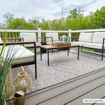 Outdoor patio scene with Beige Charcoal Areli Area Rug, modern furniture, and neutral decor creating a cozy, inviting space. Roomscene-Rectangle