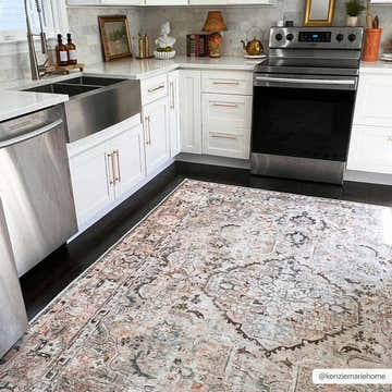 Bright kitchen with white cabinets and Standon Vintage Flat Pile Washable Rug in blue, pink, and charcoal tones. Roomscene-Rectangle