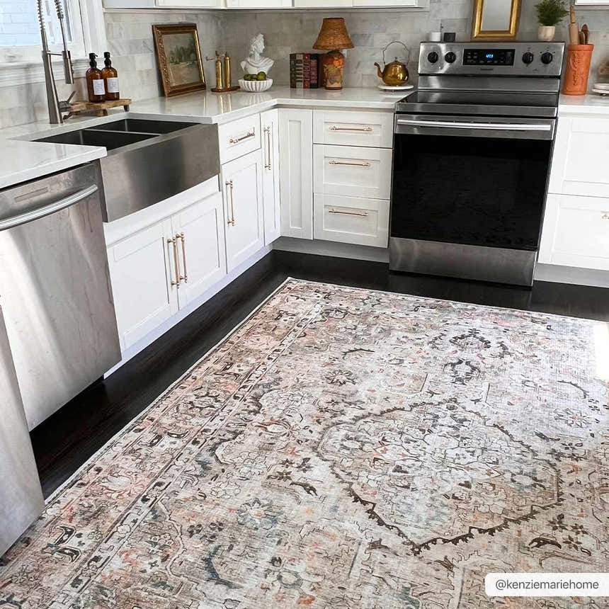 Bright kitchen with white cabinets and Standon Vintage Flat Pile Washable Rug in blue, pink, and charcoal tones. Roomscene-Rectangle
