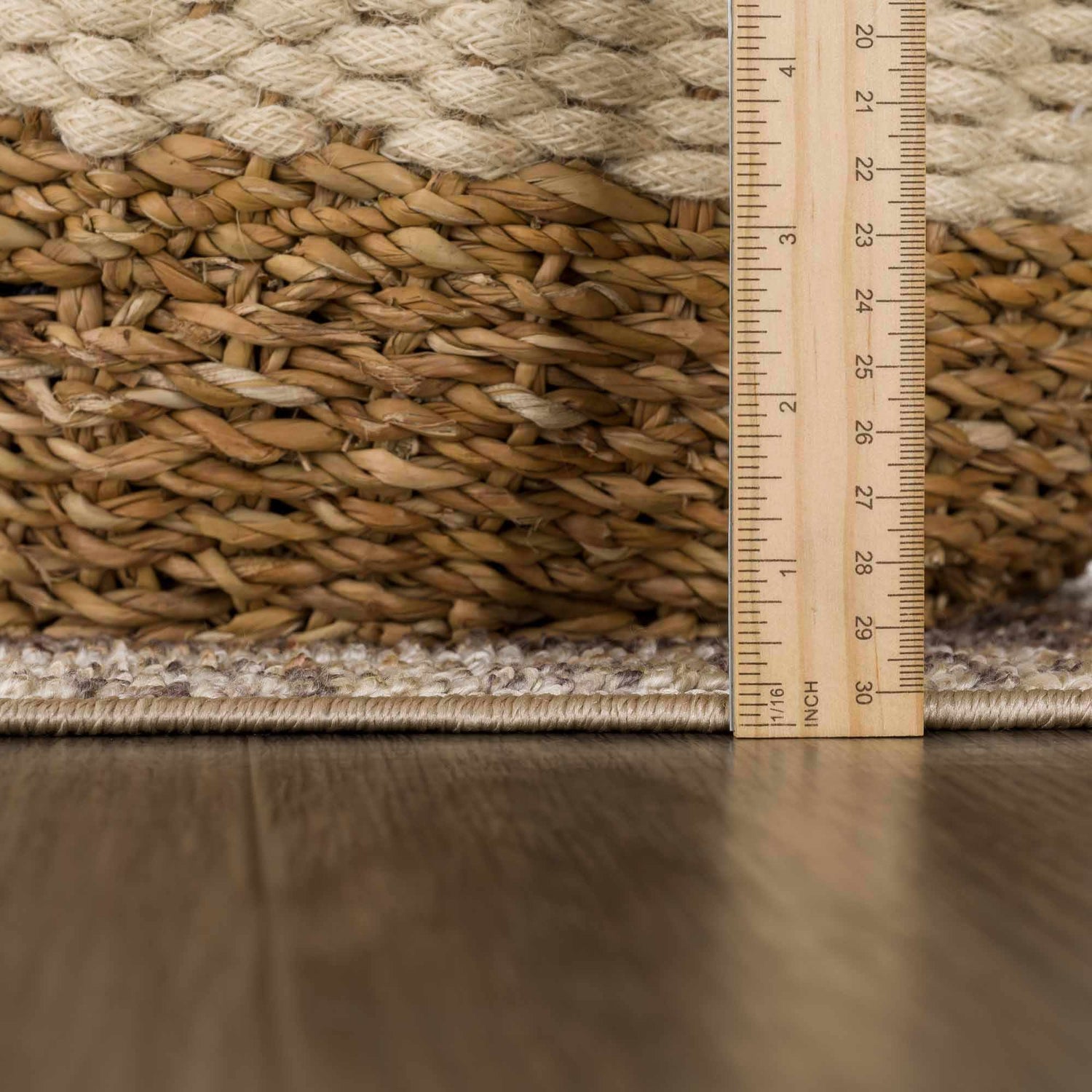 Close up of the Albas Washable Area Rug showing the light brown, dark brown, and light blue colors and the rug's texture. Pile