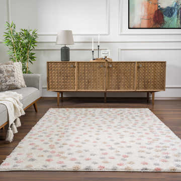 Living room scene with Cansu Pink & Cream Dotted Area Rug, gray sofa, and wood cabinet. Modern, bohemian style. Roomscene-Rectangle