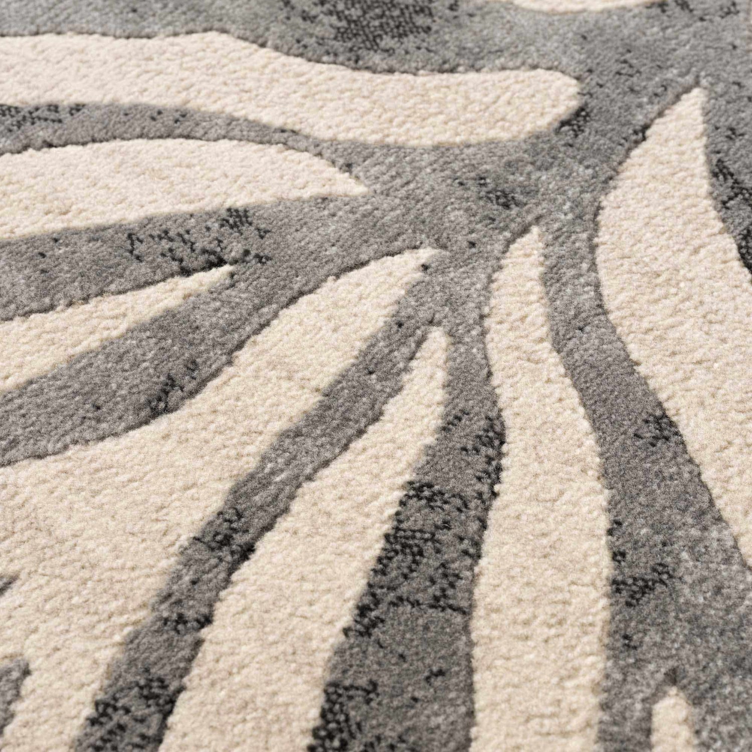 Close-up of the Gray Ecorse Zebra Print Area Rug showing the texture and gray, beige, and charcoal zebra pattern. Texture