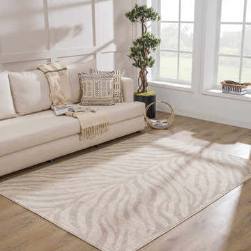 Living room with a light beige sofa and Beige Manteca Zebra Print Area Rug. Roomscene-Rectangle