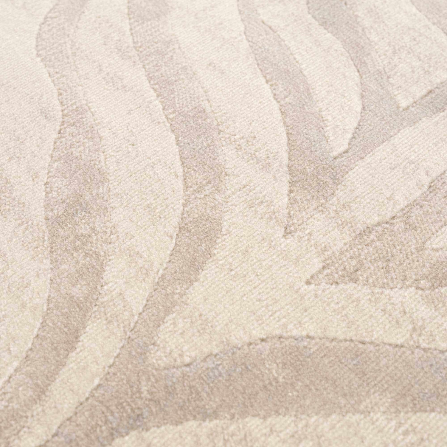 Close-up of the Beige Manteca Zebra Print Area Rug showing its light beige and gray animal pattern and soft, textured weave. Texture
