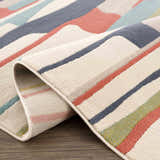 Close-up of Southfields Colorful Modern Area Carpet showing the texture and colorful, geometric pattern. Fold