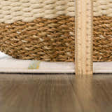 Close-up of the Southfields Colorful Modern Area Carpet showing the pile height with a ruler and a woven basket. Pile