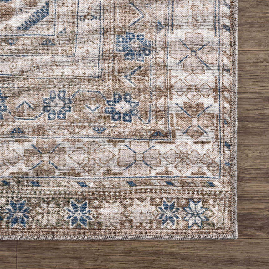 Close-up of the Baltinglass Flat Pile Washable Rug. Features a traditional oriental pattern in blue, cream, and beige tones. Swatch