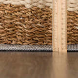 Close-up of the Baltinglass Flat Pile Washable Rug showing its flat weave and chenille-polyester texture next to a ruler. Pile