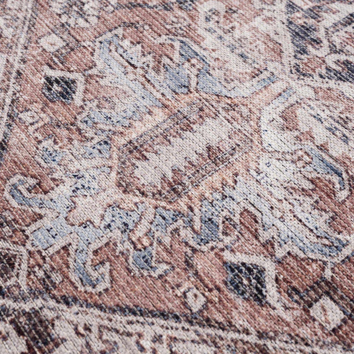 Close-up of the Viho Vintage Flat Pile Washable Rug, showcasing its brown, blue, and white traditional pattern and chenille texture. Texture