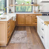 Dowell Luxe Textured Area Rug in a bright kitchen with wood cabinets and hardwood floors. Roomscene-Rectangle