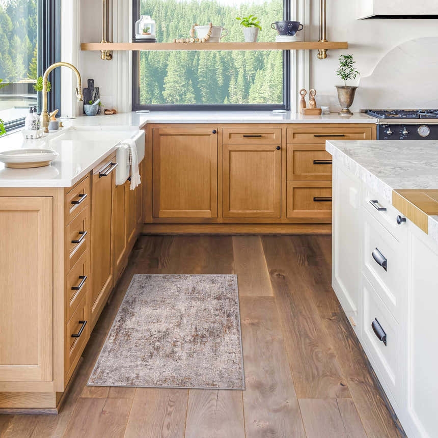 Dowell Luxe Textured Area Rug in a bright kitchen with wood cabinets and hardwood floors. Roomscene-Rectangle