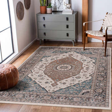 Living room scene with a Baychester Area Rug in cream, denim, and brown, styled with a gray dresser and woven chair. Roomscene-Rectangle