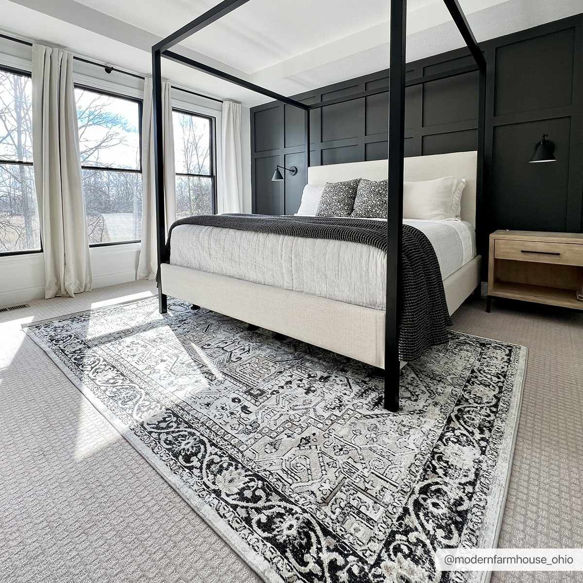 Bedroom scene with black canopy bed and the black and gray vintage Cabacungan Washable Area Rug. Roomscene-Rectangle
