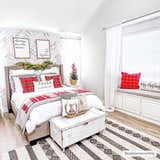 Christmas bedroom scene with a Whittington Black&White Wool Rug, bed, white chest, and red plaid accents. Roomscene-Rectangle