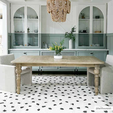 Dining room with a Chaia Dotted Black & White Plush Rug, light wood table, and sage green cabinets. Modern farmhouse style. Roomscene-Rectangle
