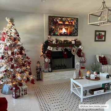 Living room with Christmas decor and Chubbuck Moroccan Trellis Rug in charcoal and beige. Fireplace, tree, white coffee table. Roomscene-Rectangle