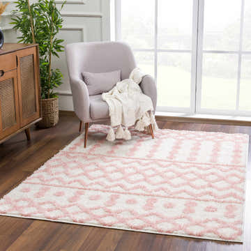 Living room scene with a pink armchair and the Darva Pink Plush Area Carpet. Roomscene-Rectangle