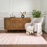 Living room scene with a Darva Pink Plush Area Carpet, gray chair, and wood cabinet. Roomscene-Rectangle