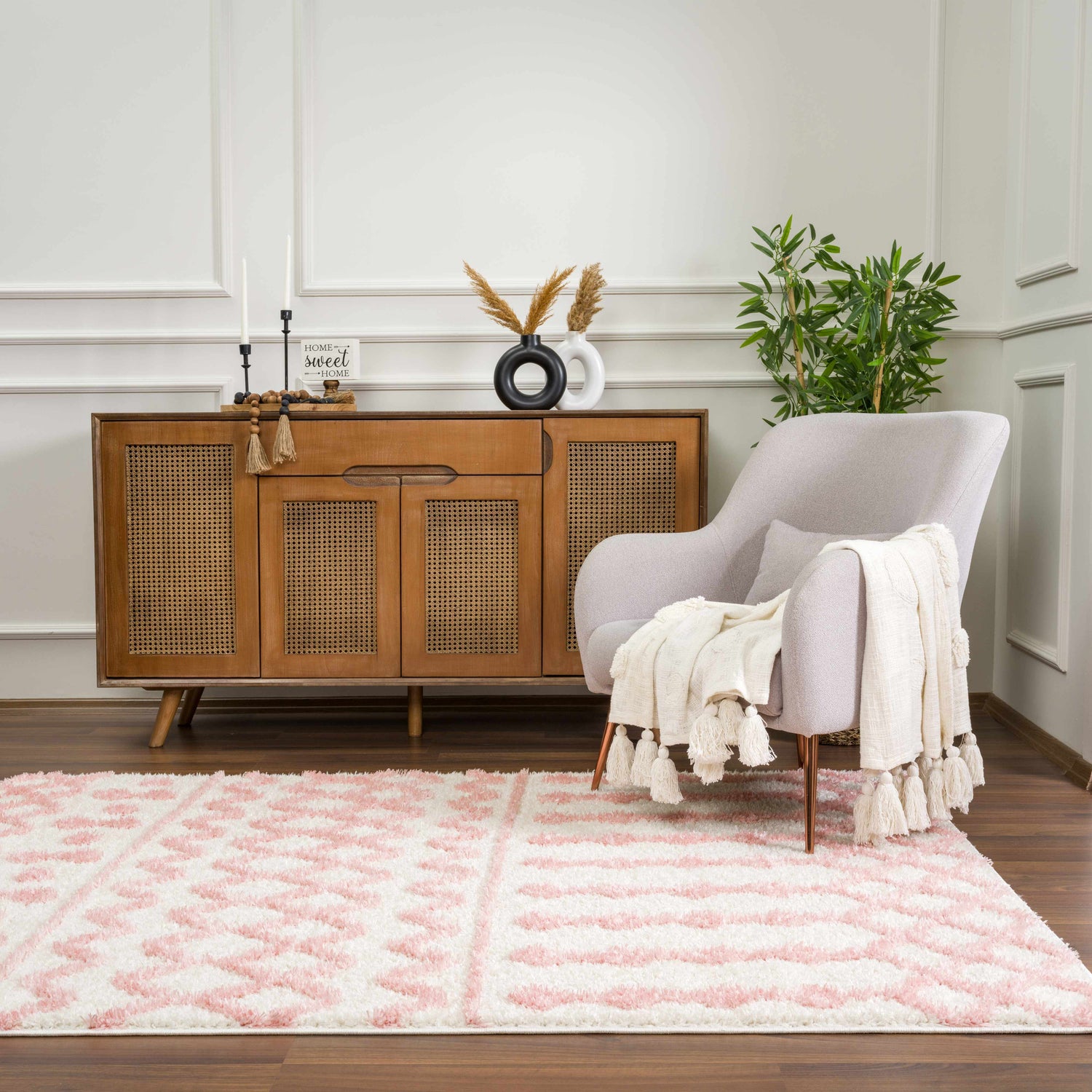 Living room scene with a Darva Pink Plush Area Carpet, gray chair, and wood cabinet. Roomscene-Rectangle
