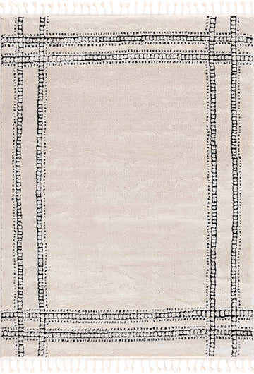 Close-up of Ryuu Black & White Area Rug, featuring a beige base with a black geometric border and tassel fringe. Contemporary style. Design-Rectangle-46