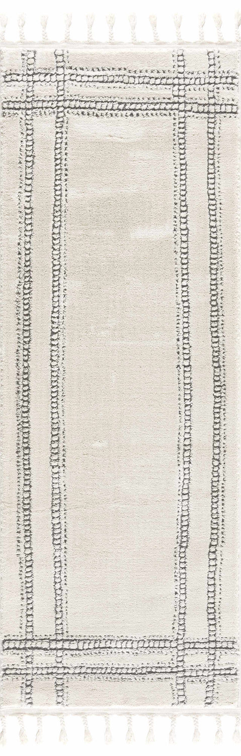 Close-up of Ryuu Ivory & Gray Area Rug featuring a geometric pattern, tassels, and a soft, textured weave. Design-Runner