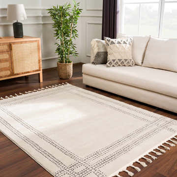 Living room scene with Ryuu Ivory & Gray area rug, cream sofa, wood cabinet, and plant for a contemporary, mid-century modern style. Roomscene-Rectangle