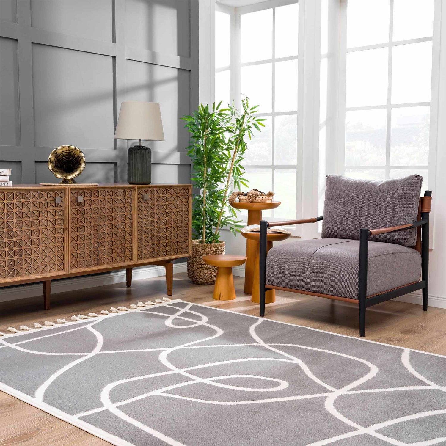 Living room scene with gray walls, wood furniture, and the Azana Modern Gray Area Rug. Roomscene-Rectangle