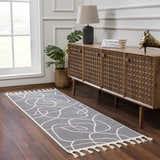 Hallway scene with Azana Modern Gray Area Rug runner, wood console table, lamp, and monstera plant. Roomscene-Runner