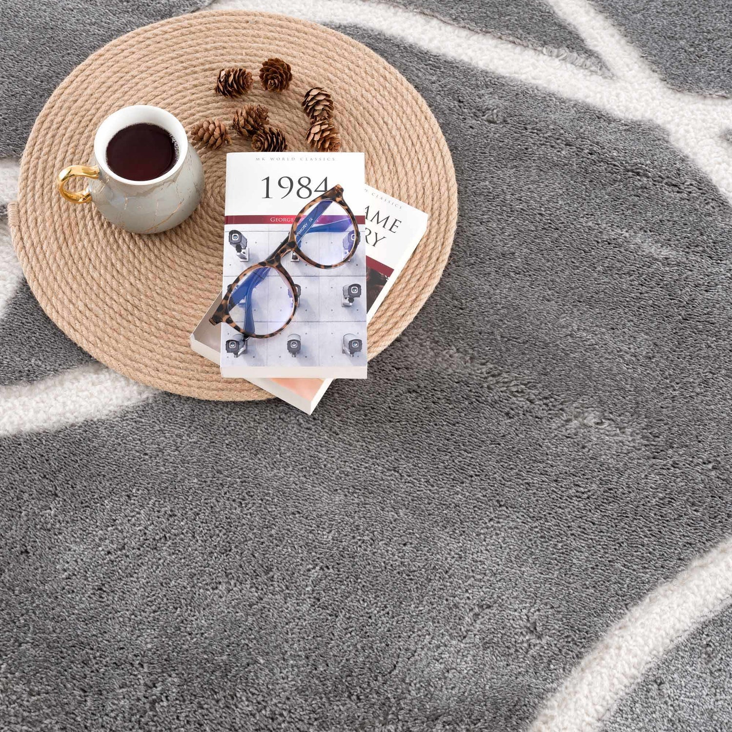 Close-up of the Azana Modern Gray Area Rug with a cream geometric pattern and soft, textured pile. Styleshot