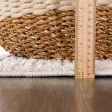 Close-up of the plush pile height of the Riad Black Striped White Rug, showing texture and a ruler for scale. Pile