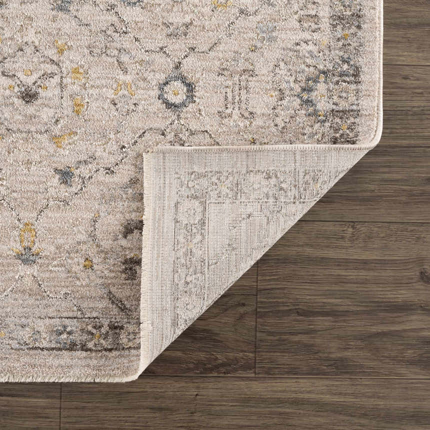 Close-up of Annie Cream Textured Rug showing cotton weave, traditional pattern, and color variations. Fold