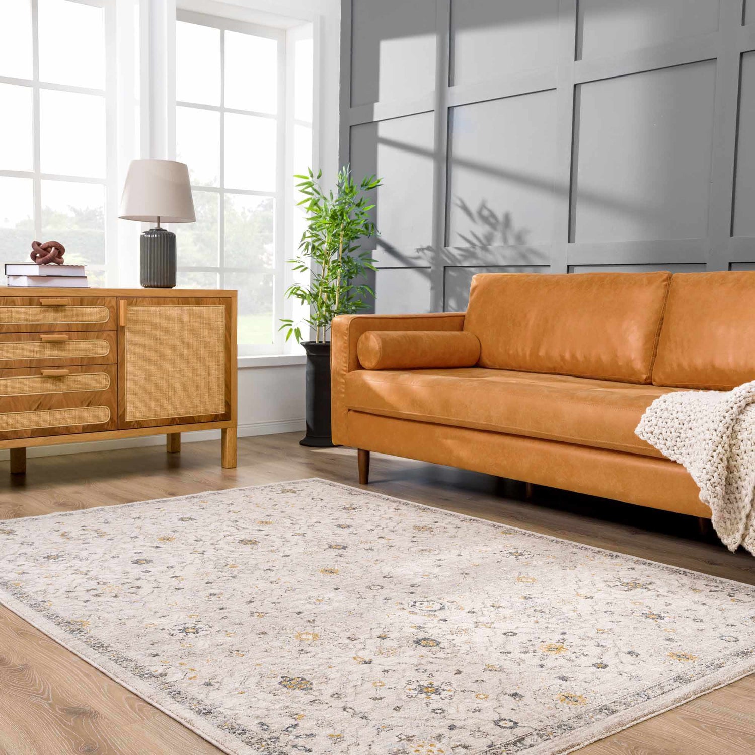Living room with tan leather sofa and Annie Cream Textured Rug. Farmhouse style. Roomscene-Rectangle