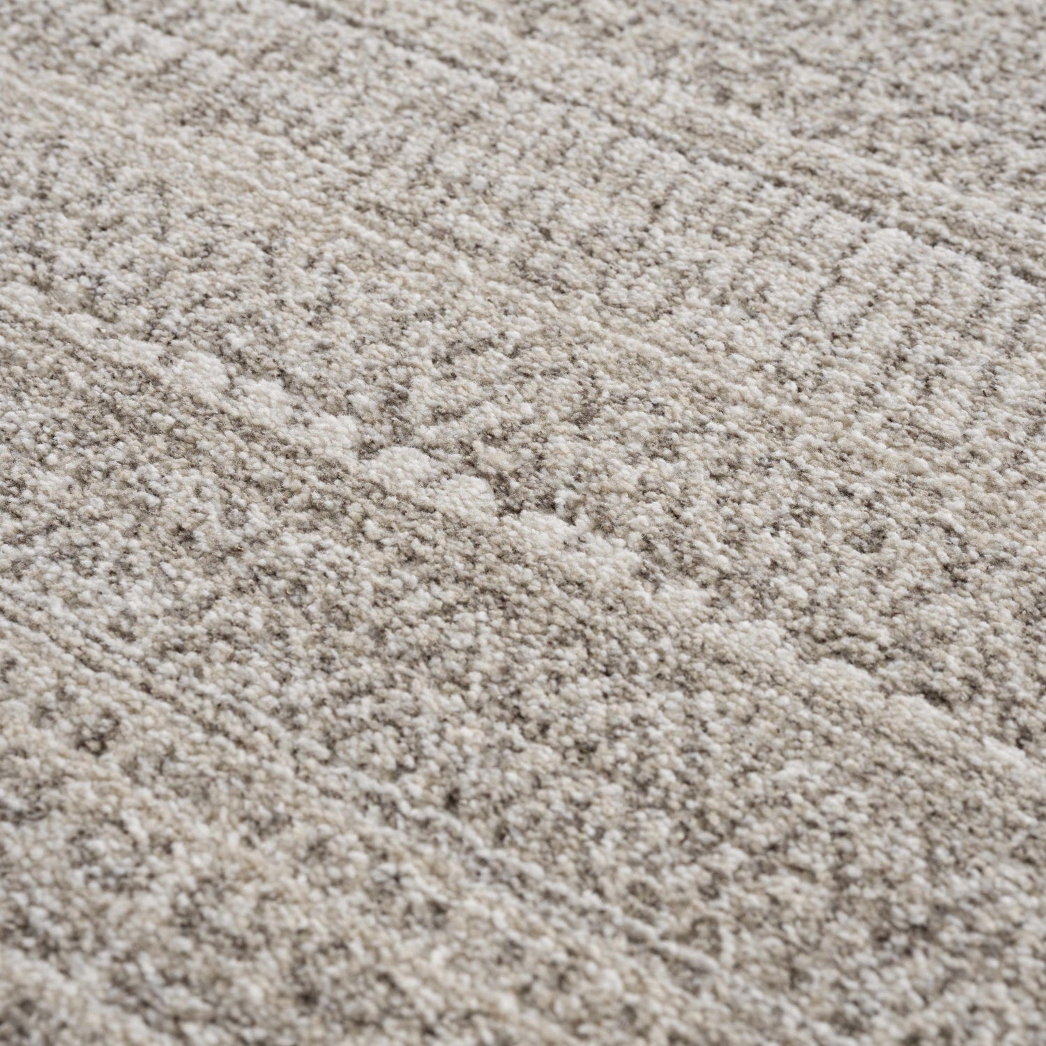 Close-up of the Nate Beige Tribal High Pile Carpet showing its plush texture and subtle beige and ivory tones. Texture