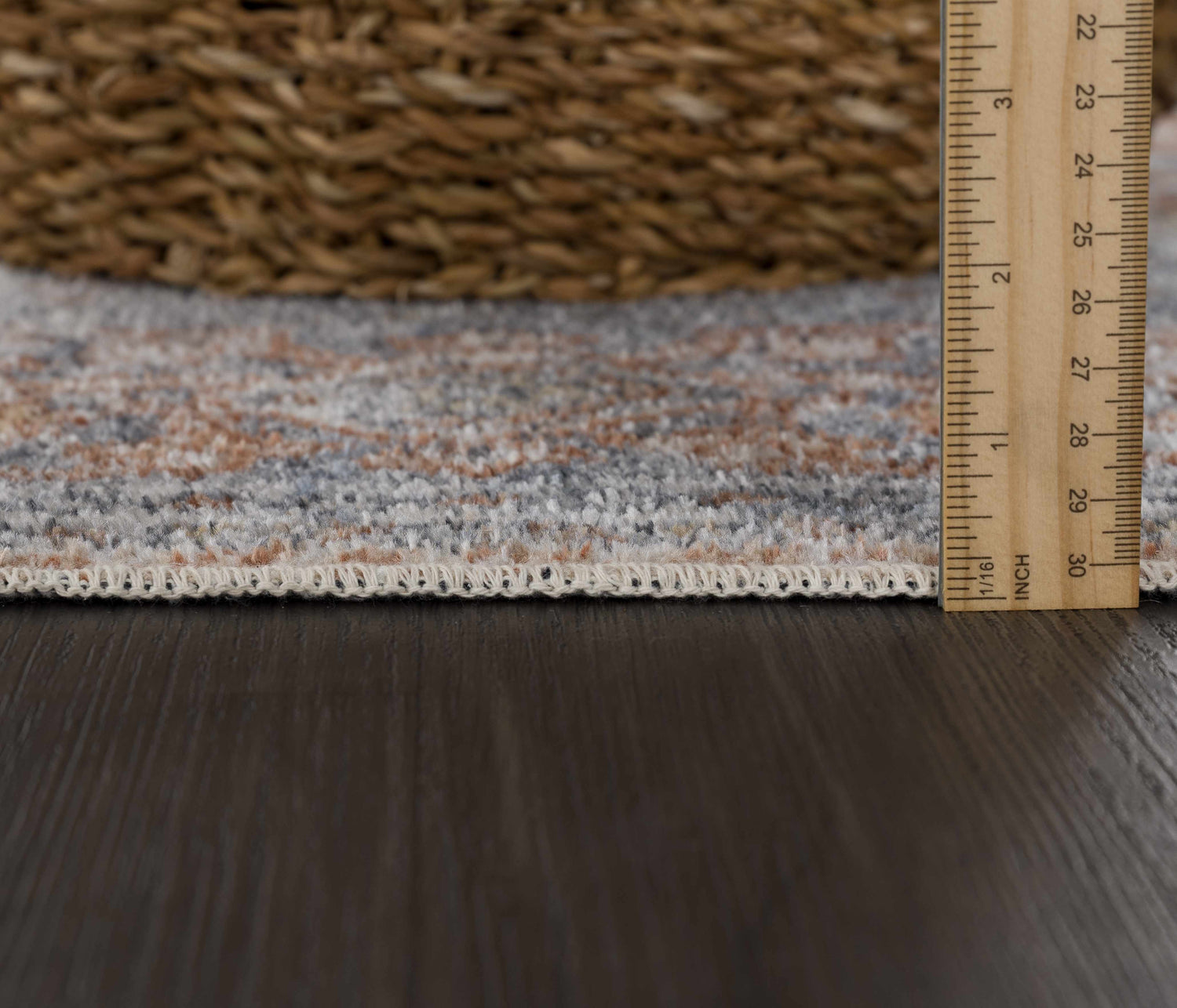 Close-up of the Aila Traditional Design Washable Rug showing the pile height and traditional vintage pattern. Pile