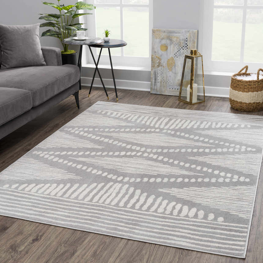 Living room scene with gray sofa and Tigrisis 2326 Gray Rug. Farmhouse style with Moroccan-inspired ivory pattern. Roomscene-Rectangle
