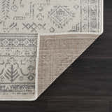 Close-up of Tigried Ivory & Gray 2323 Area Rug showing its traditional gray pattern, ivory color, and rug backing. Fold